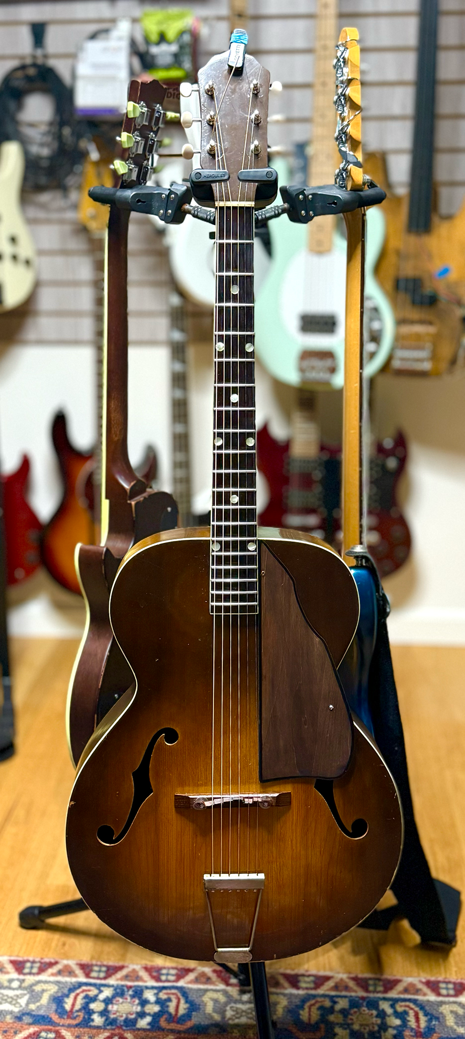 My finished guitar, sitting on a stand.